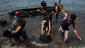 Afghan immigrants arrive on a dinghy on the Greek island of Lesbos after crossing a part of the Aegean Sea between Turkey and Greece, August 6, 2015. The U.N refugee agency, UNHCR, estimates that Greece has received more than 107,000 refugees and migrants this year, more than double its 43,500 intake of 2014. REUTERS/Yiannis Kourtoglou TPX IMAGES OF THE DAY