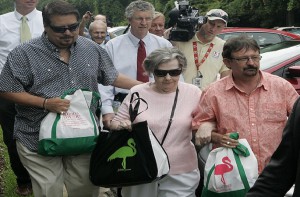 Powerball winner Gloria C. Mackenzie, 84, leaves the lottery office escorted by her son Scott Mackenzie, right, after claiming a single lump-sum payment of about $370.9 million before taxes on Wednesday, June 5, 2013, in Tallahassee, Fla. Officials say she is the largest sole lottery winner in U.S. history. She did not speak to reporters outside lottery headquarters, leaving in a silver Ford Focus with family members. (AP Photo/Steve Cannon)