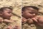 يفجر الغضب.. سعودي يطعم طفله الرضيع رملا ونصف جسده مدفون والسلطات تتحرك (فيديو)