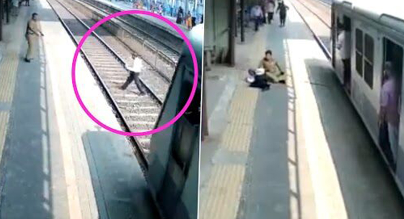 رجل يتفادى الموت بأعجوبة بعد السير أمام قطار سريع (فيديو)