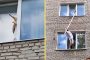 رجل ينقذ قطة علقت في فتحة النافذة بطريقة ذكية (فيديو)
